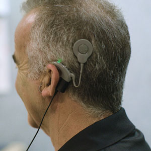 Older man wearing a cochlear implant
